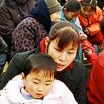 group of Chinese onlookers