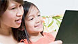 Mother reading to daughter