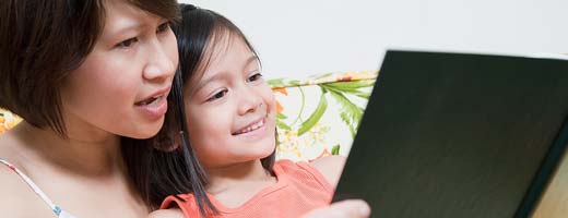 mother reads book to child