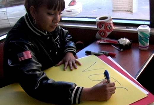 volunteer makes sign