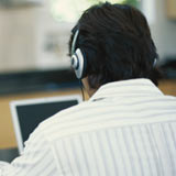Man with headphones and laptop