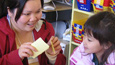 Student teacher Koy Saechao works on vocabulary with bilingual kindergarten students at the Language Academy of Sacramento.