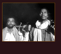 two african men with rifles