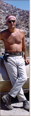 bob standing in front of a car