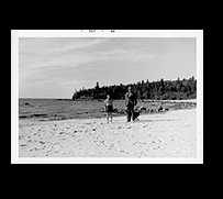 a man and boy on a beach
