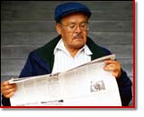 man reading newspaper
