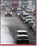 snowy highway with cars