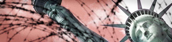 Statue of Liberty behind a blurred tangle of barbed wire