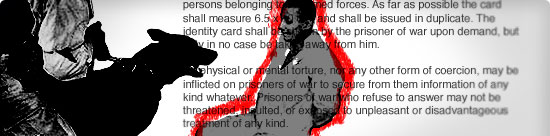 dog held by gloved figure appears to lunge at seated prisoner